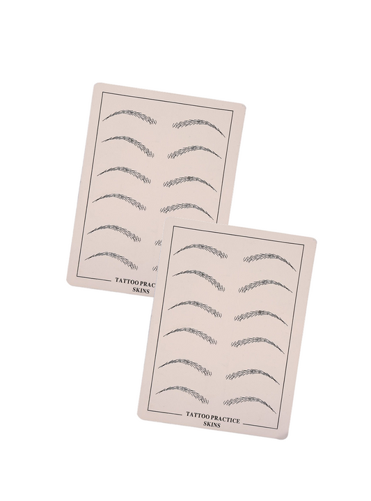 Two sheets of tattoo practice skins on a light blue background