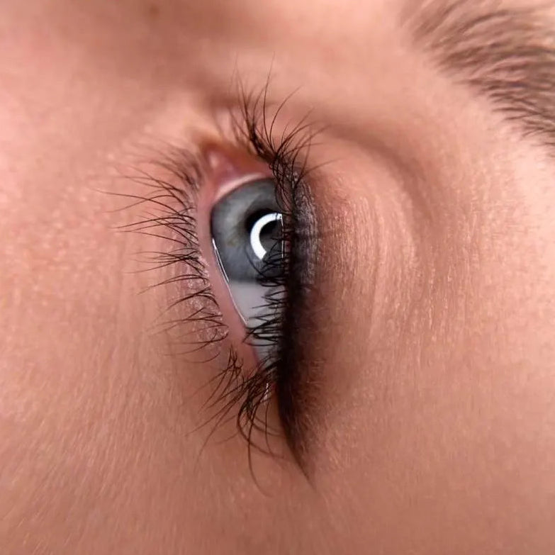 Close-up of a person's eye with detailed makeup hanafy eyeliner hanafy healed after 2 years