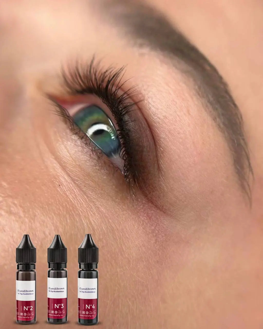 Close-up of an eye with colored permanent makeup and eyes and brows kostinetskaya hanafy pigments