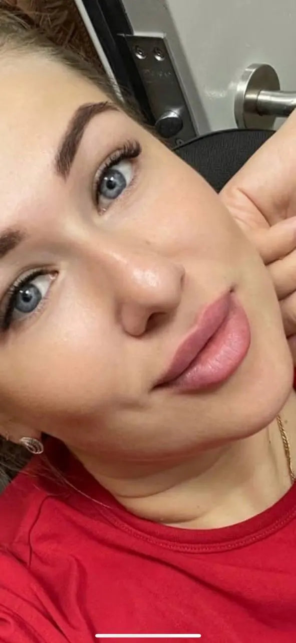 Close-up of a person wearing a red shirt with a blurred background hanafy healed lips