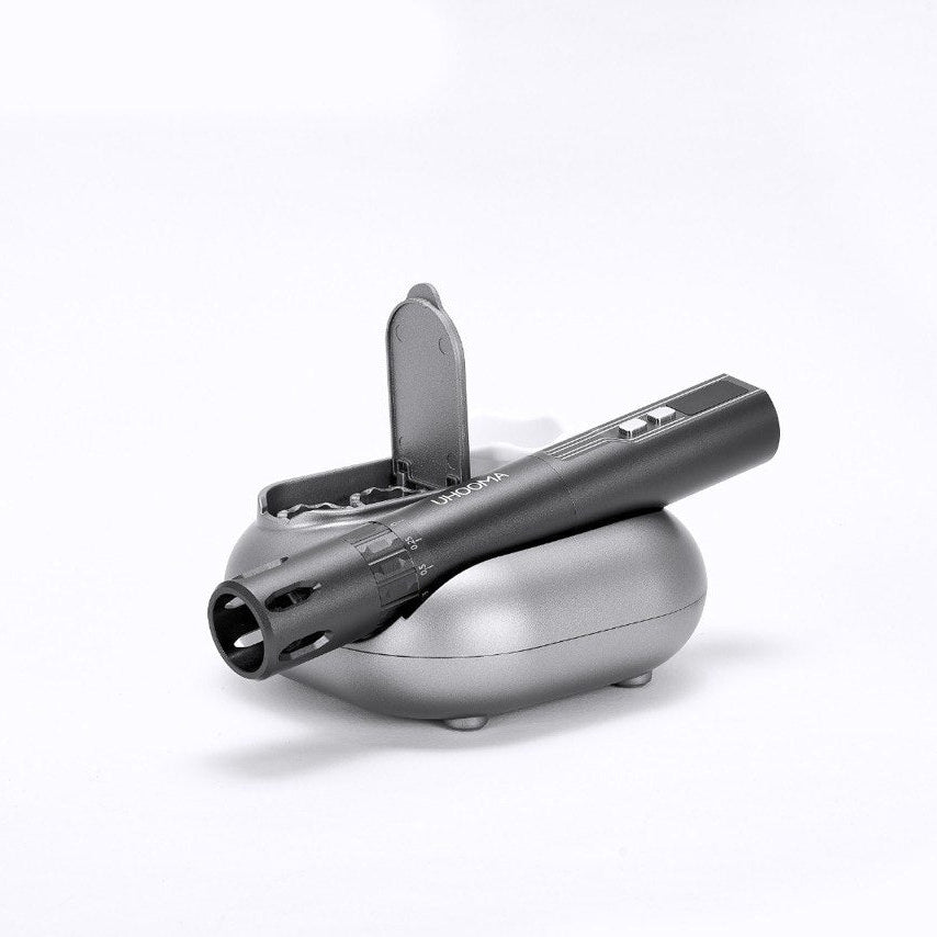 Uhooma M20 hydra microneedling pen on its base